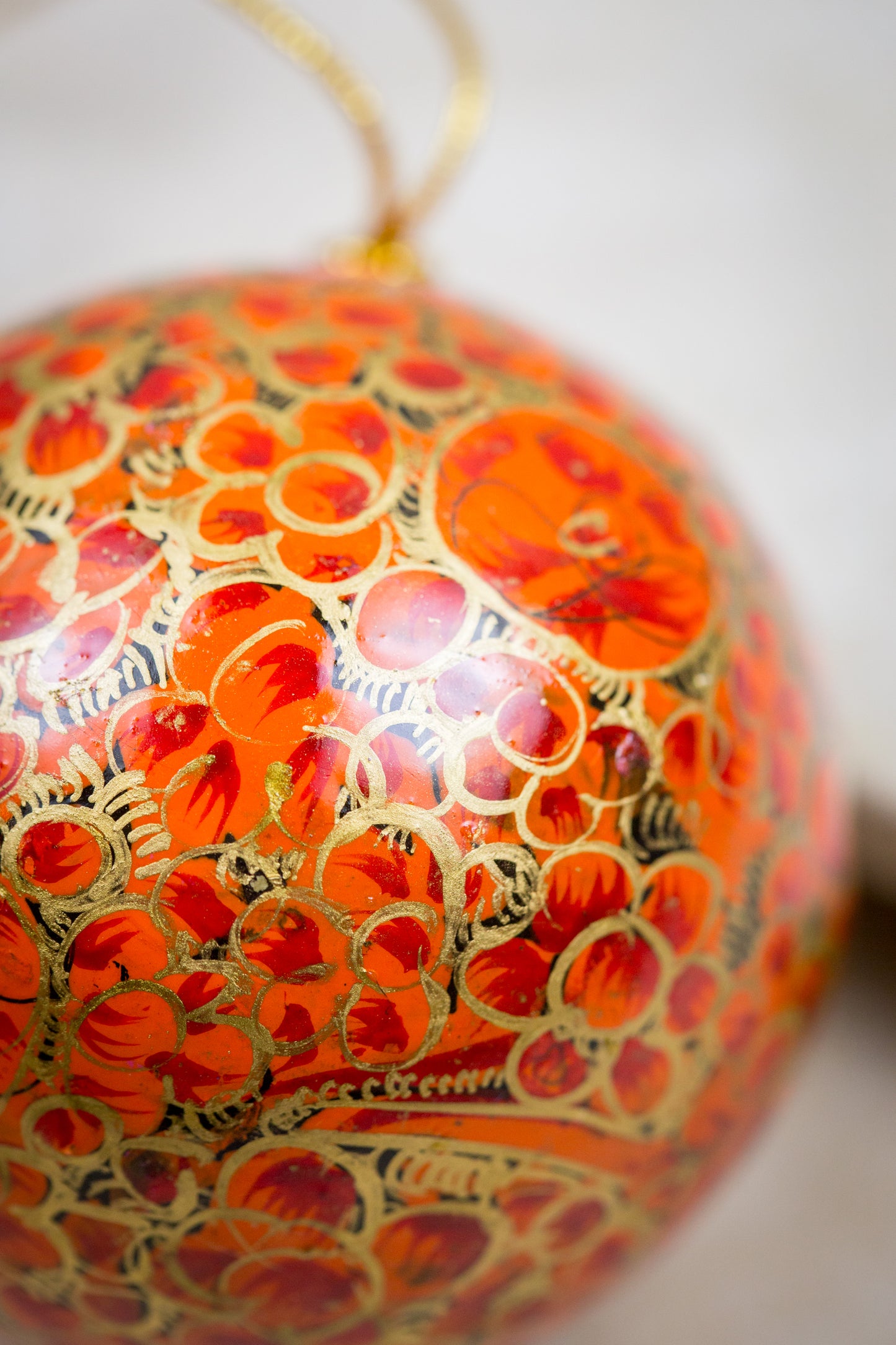 Handmade and hand painted decorative ornament orange red gold